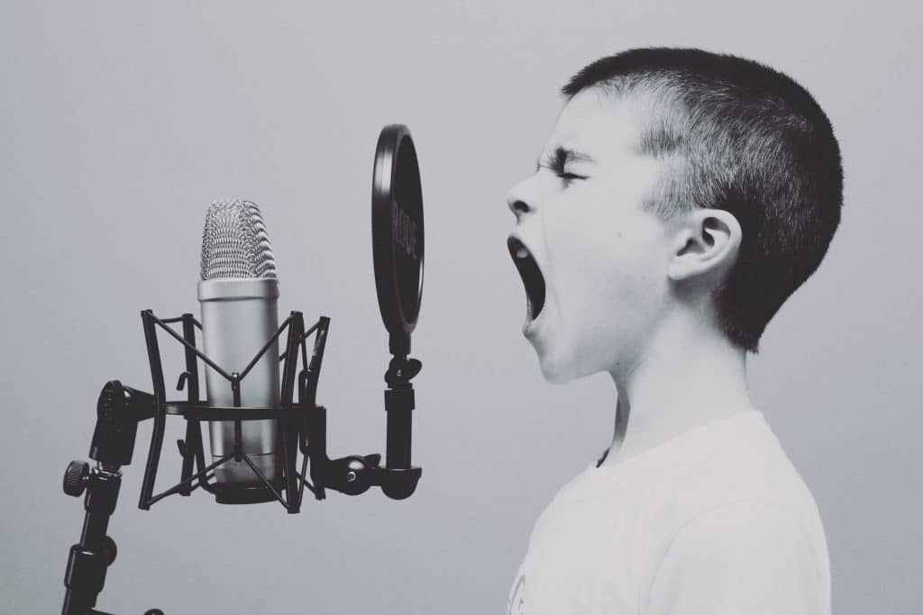 Child Practising Vocals on Mic